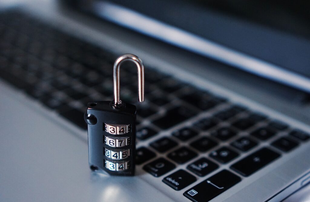 a combination lock kept on the keyboard of a laptop